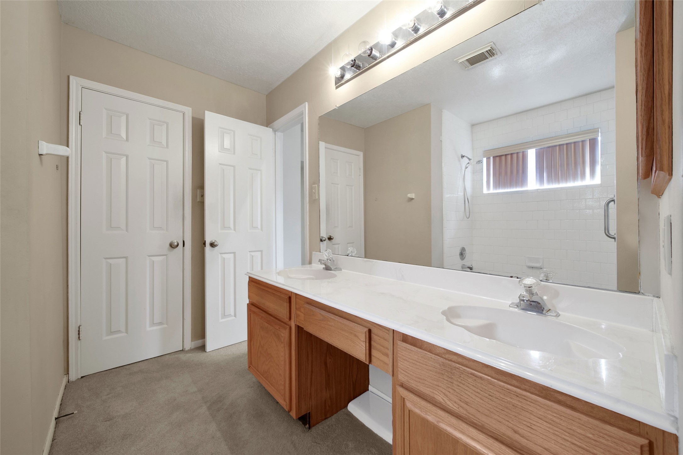 19110 Timber Way Drive Humble, TX 77346 - Photo 18 of 24 a bathroom with a sink double vanity and a mirror