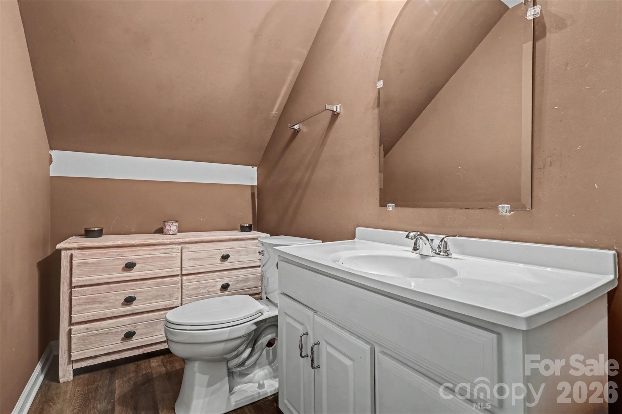 2262 Center Road Chester, SC 29706 - Photo 18 of 31 a bathroom with a toilet sink and mirror