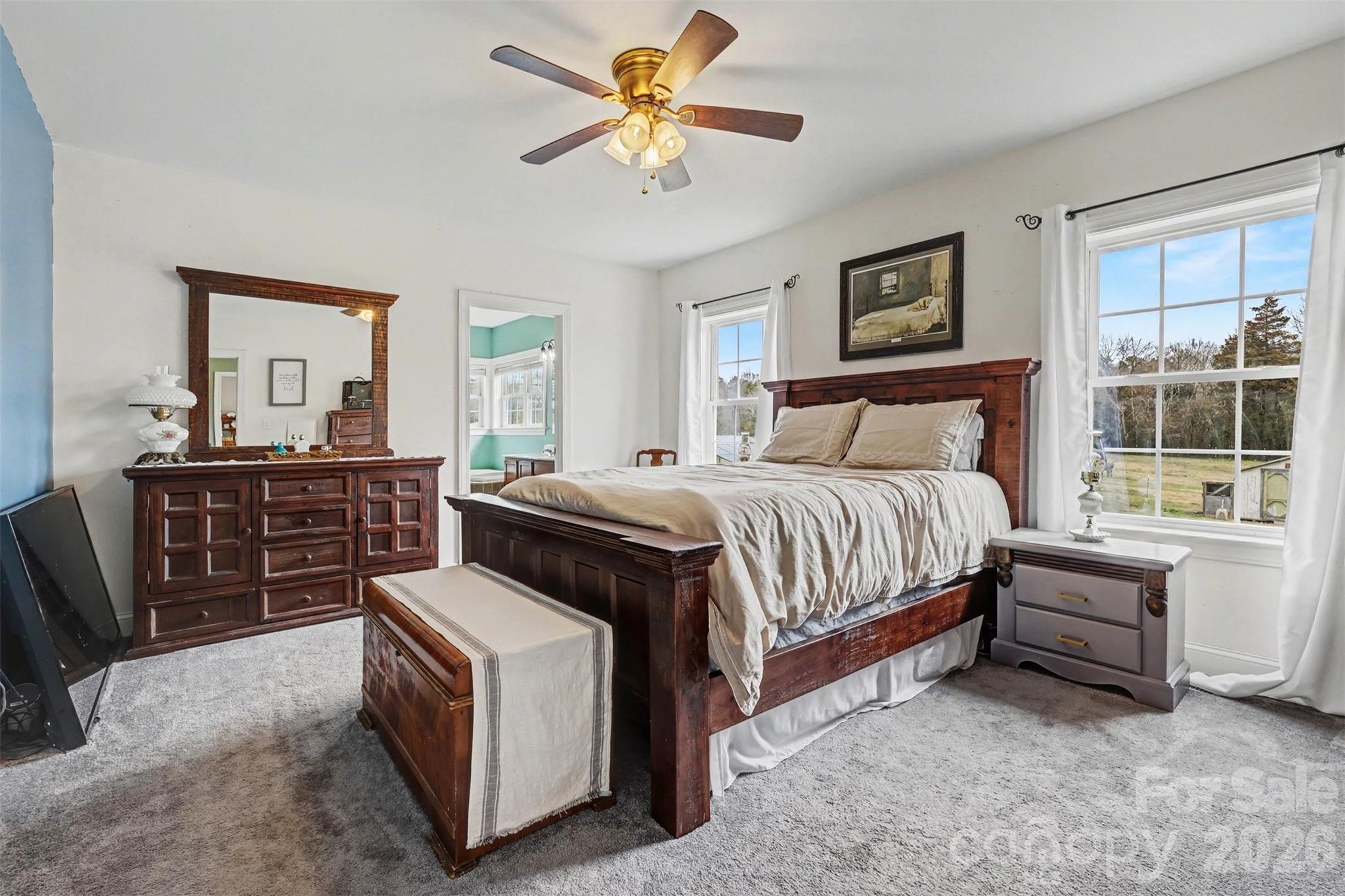 2262 Center Road Chester, SC 29706 - Photo 24 of 31 a bedroom with a bed and a chandelier