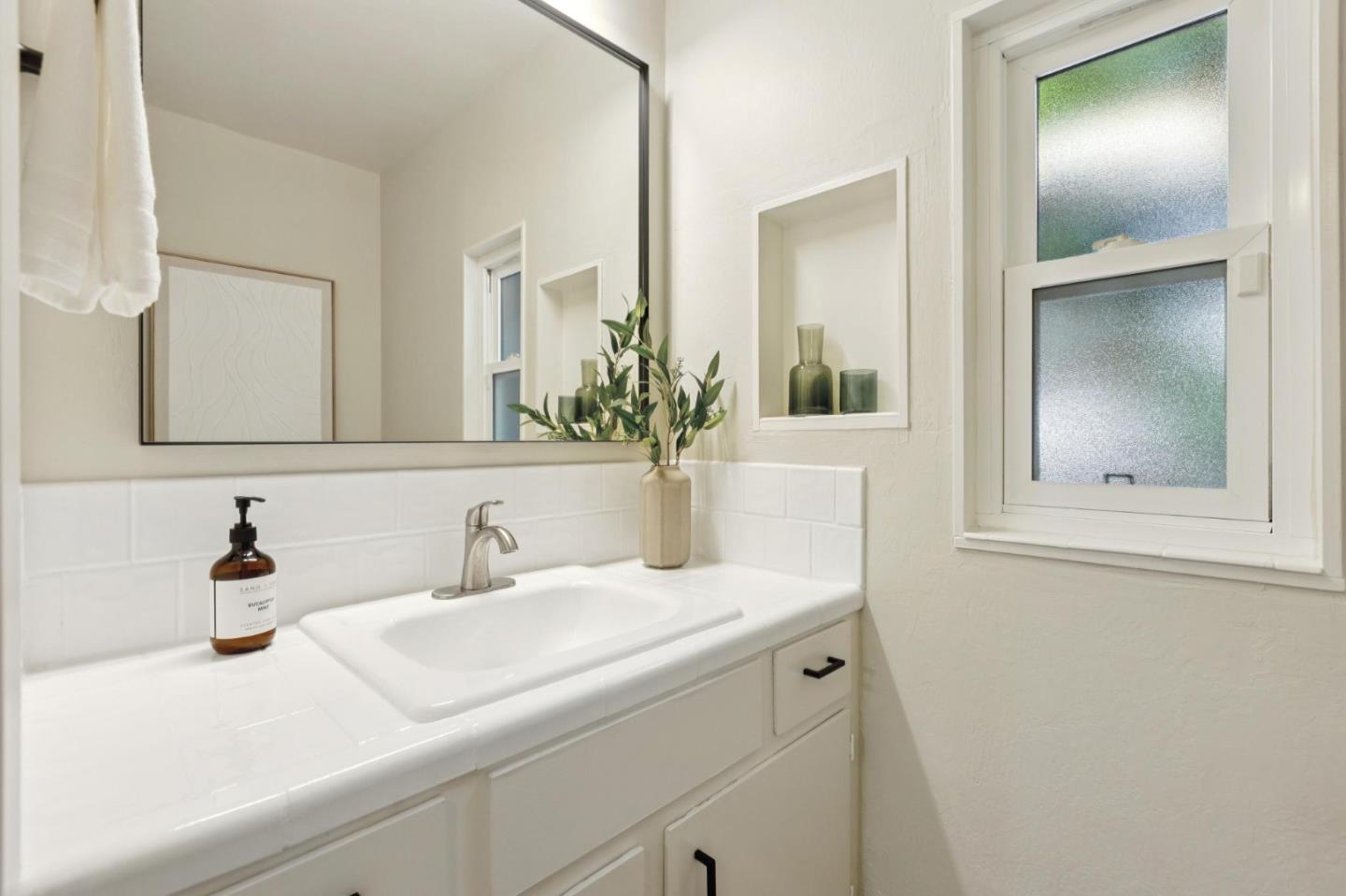 755 Santa Rita Avenue Los Altos, CA 94022 - Photo 25 of 50 a bathroom with a sink and a mirror