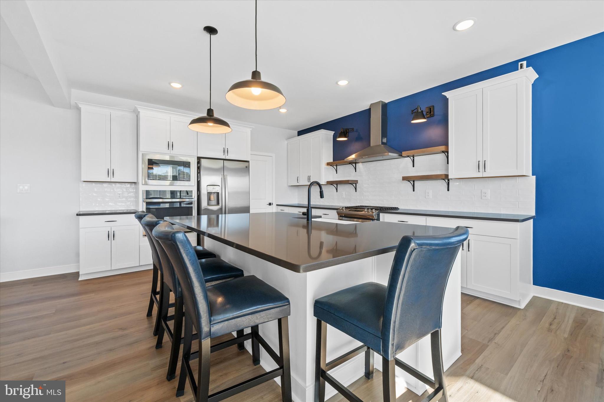 208 South Rdg Brk Drive Felton, DE 19943 - Photo 20 of 44 a view of a dining room with furniture and wooden floor