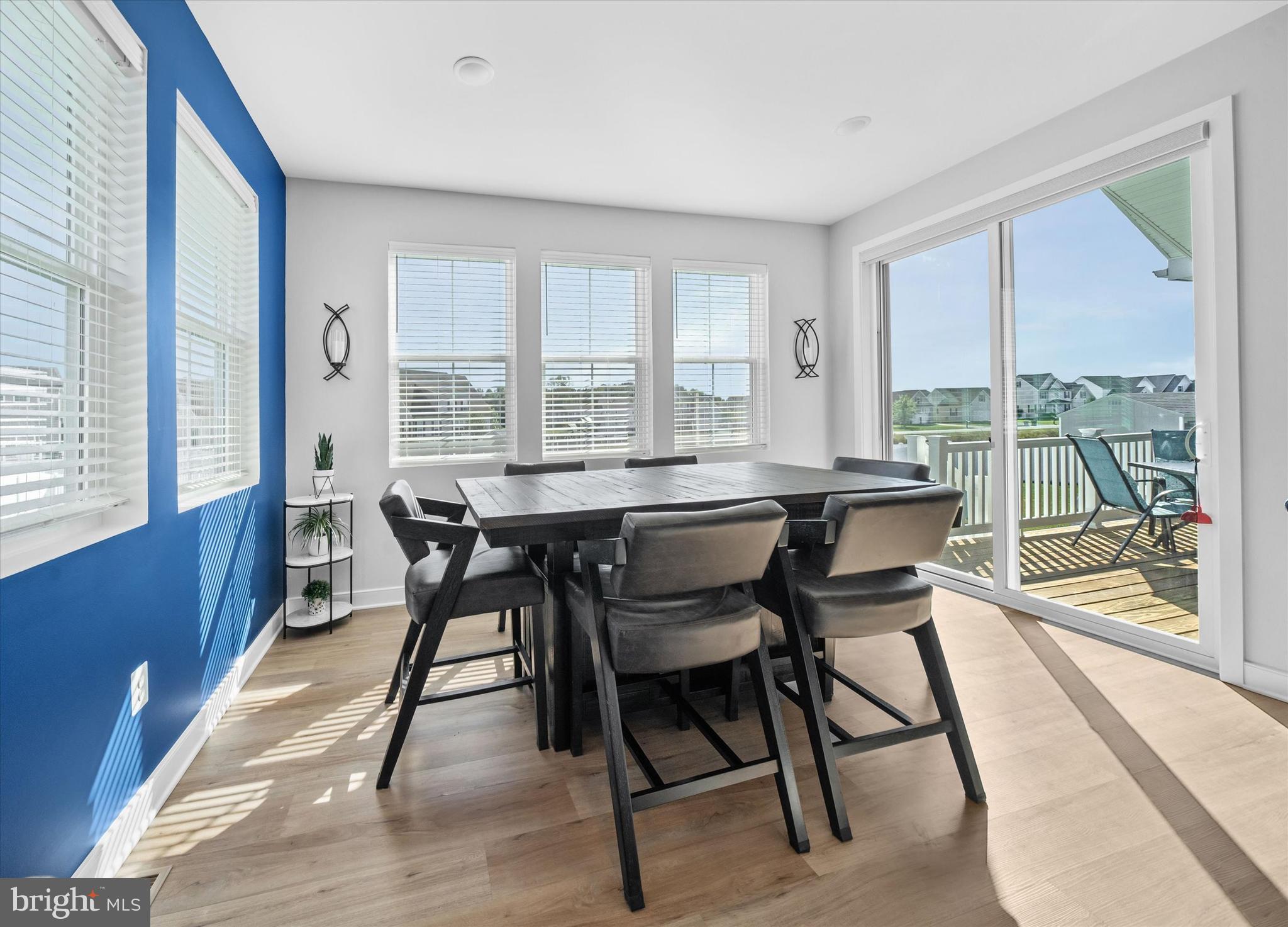 208 South Rdg Brk Drive Felton, DE 19943 - Photo 22 of 44 a view of a dining room with furniture large windows and wooden floor