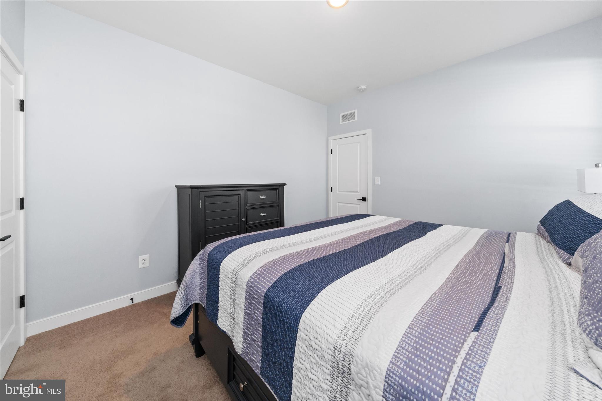 208 South Rdg Brk Drive Felton, DE 19943 - Photo 32 of 44 a bedroom with a bed and a window