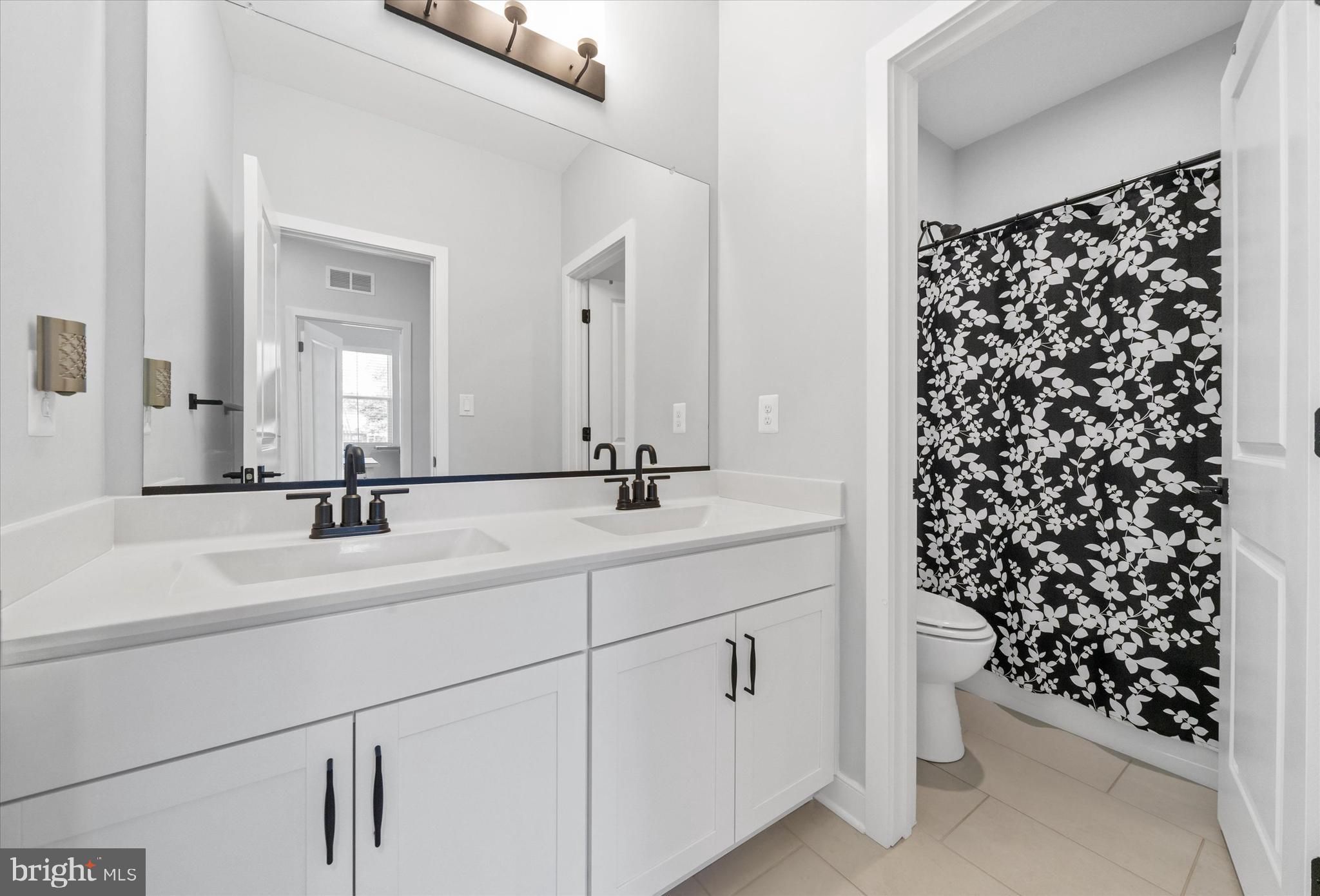 208 South Rdg Brk Drive Felton, DE 19943 - Photo 35 of 44 a bathroom with a sink and a mirror