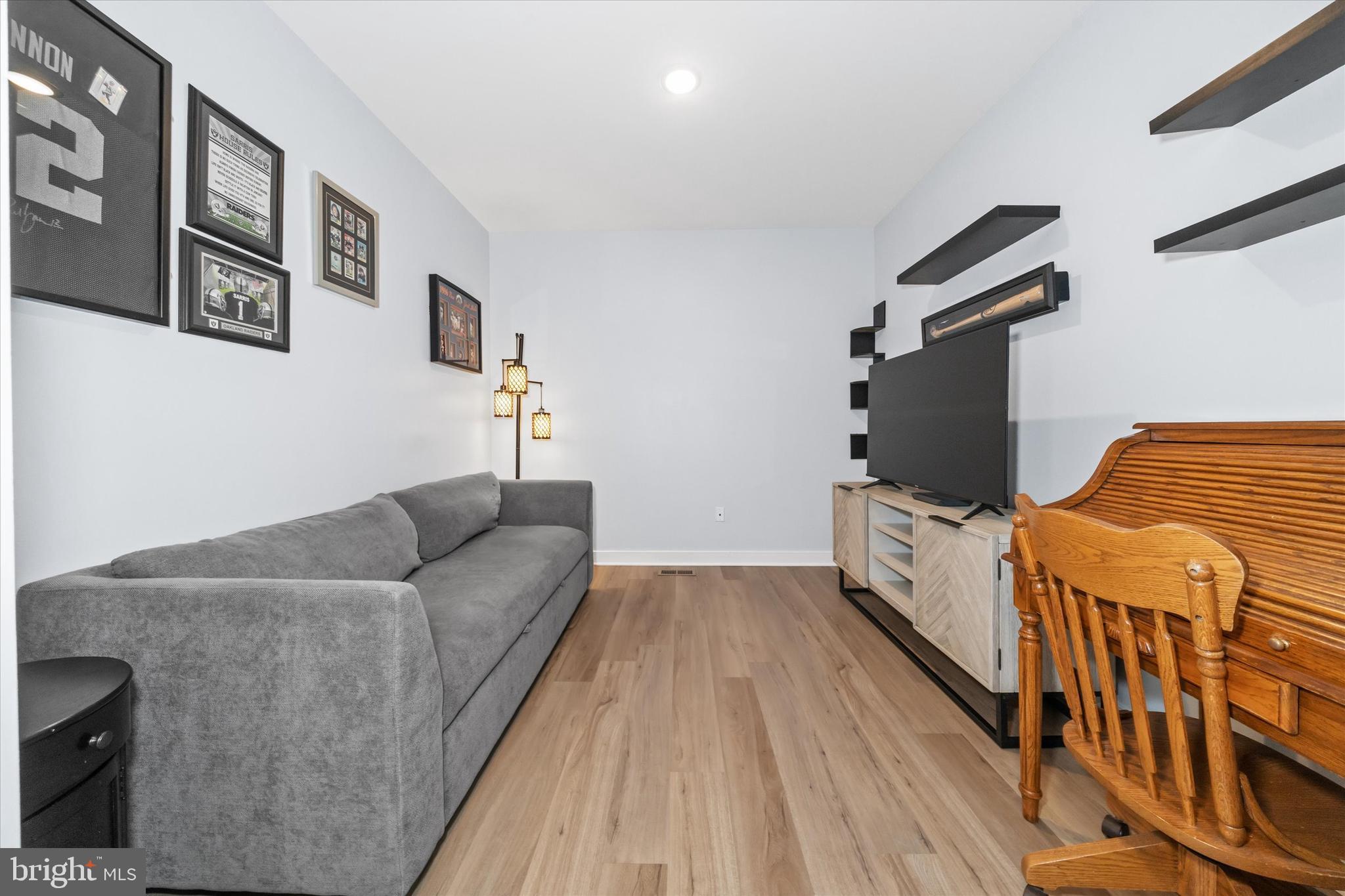 208 South Rdg Brk Drive Felton, DE 19943 - Photo 9 of 44 a living room with furniture and a flat screen tv