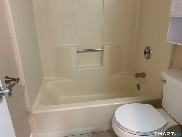 a wooden bench sitting in the middle of a forest