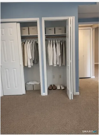 a white refrigerator freezer and a stove sitting inside of a kitchen