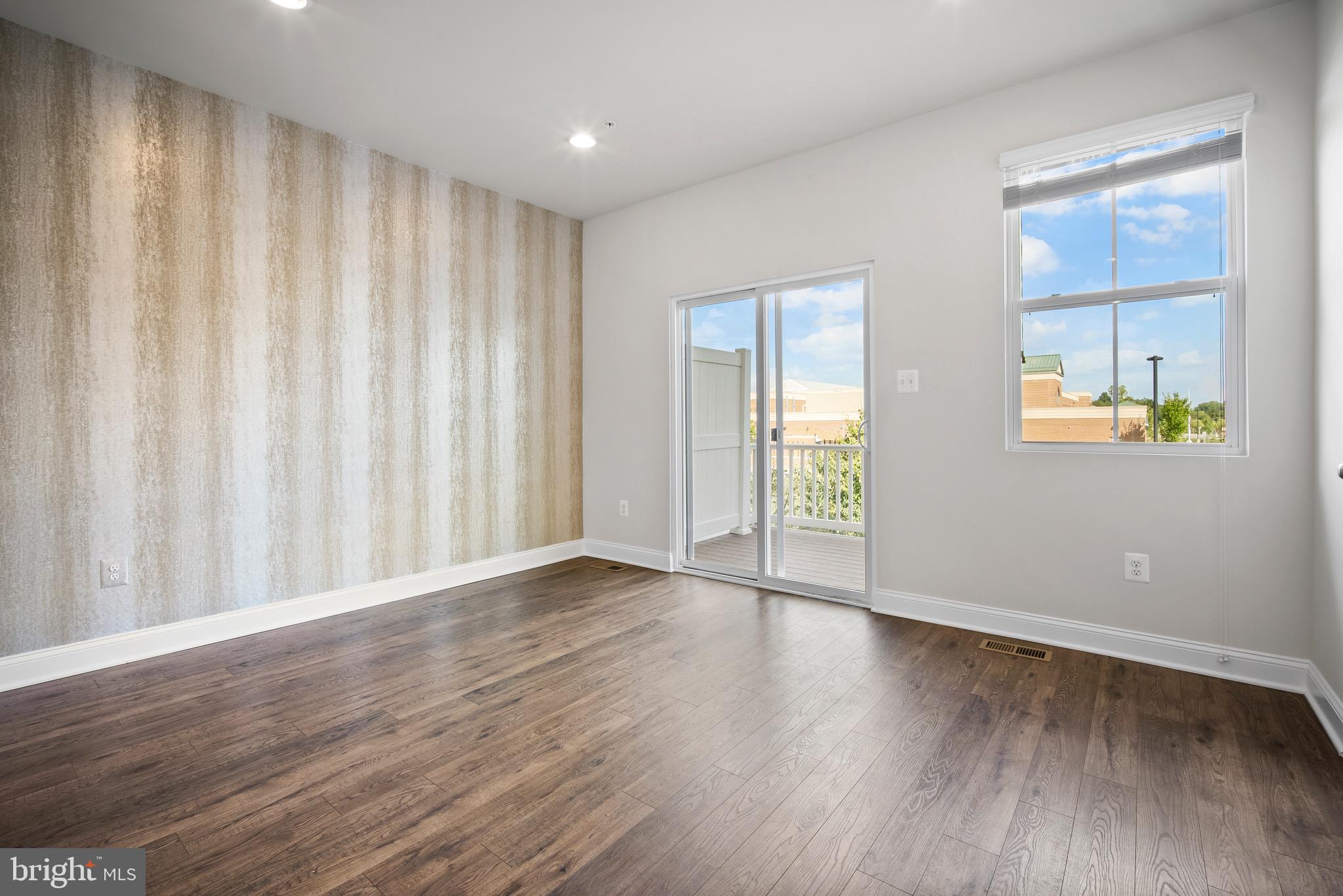 7012 Rackham Way Hanover, MD 21076 - Photo 11 of 46 Dining Area | Balcony Access | Hardwood Throughout