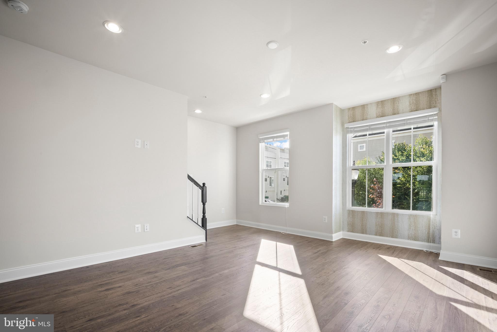 7012 Rackham Way Hanover, MD 21076 - Photo 13 of 46 Family Area with Window Treatments and Accent Wall