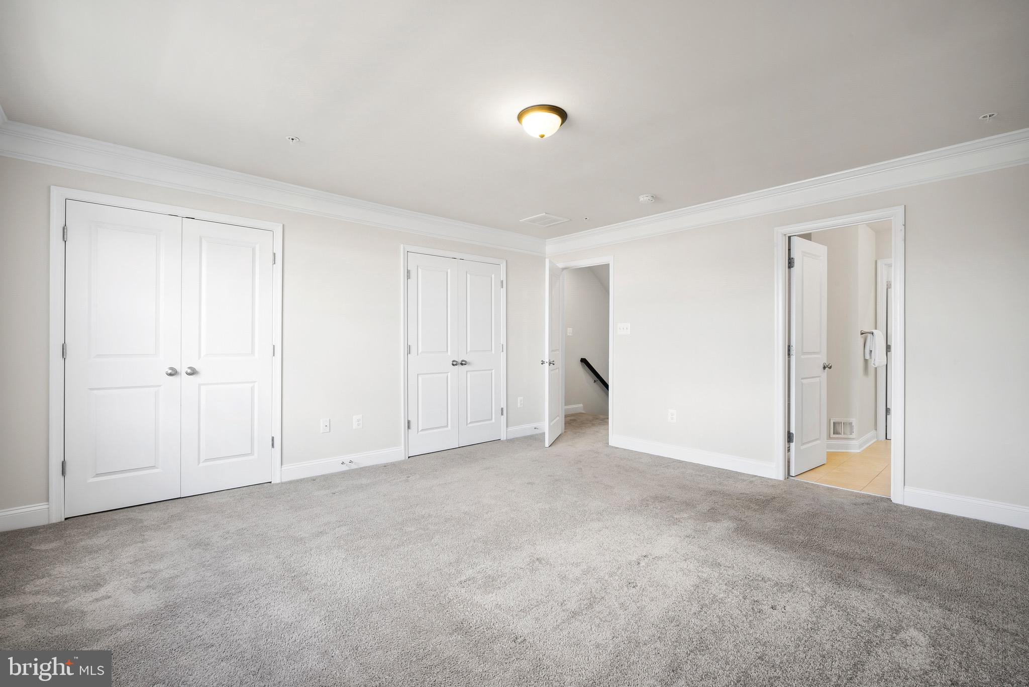 7012 Rackham Way Hanover, MD 21076 - Photo 14 of 46 Owners Suite | Crown Molding Two Custom Closets.