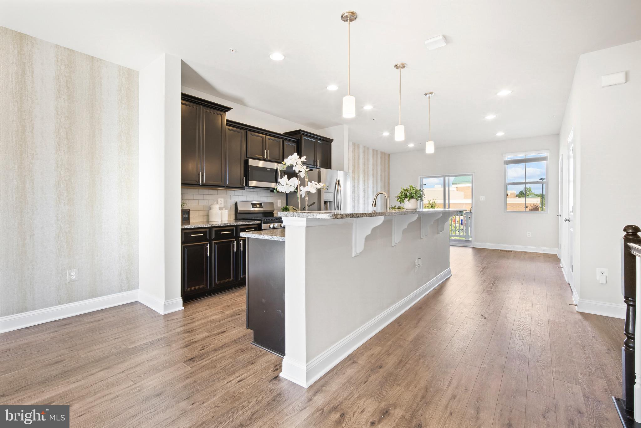 7012 Rackham Way Hanover, MD 21076 - Photo 8 of 46 Upgraded Kitchen | Island Seating | Pendant Lights