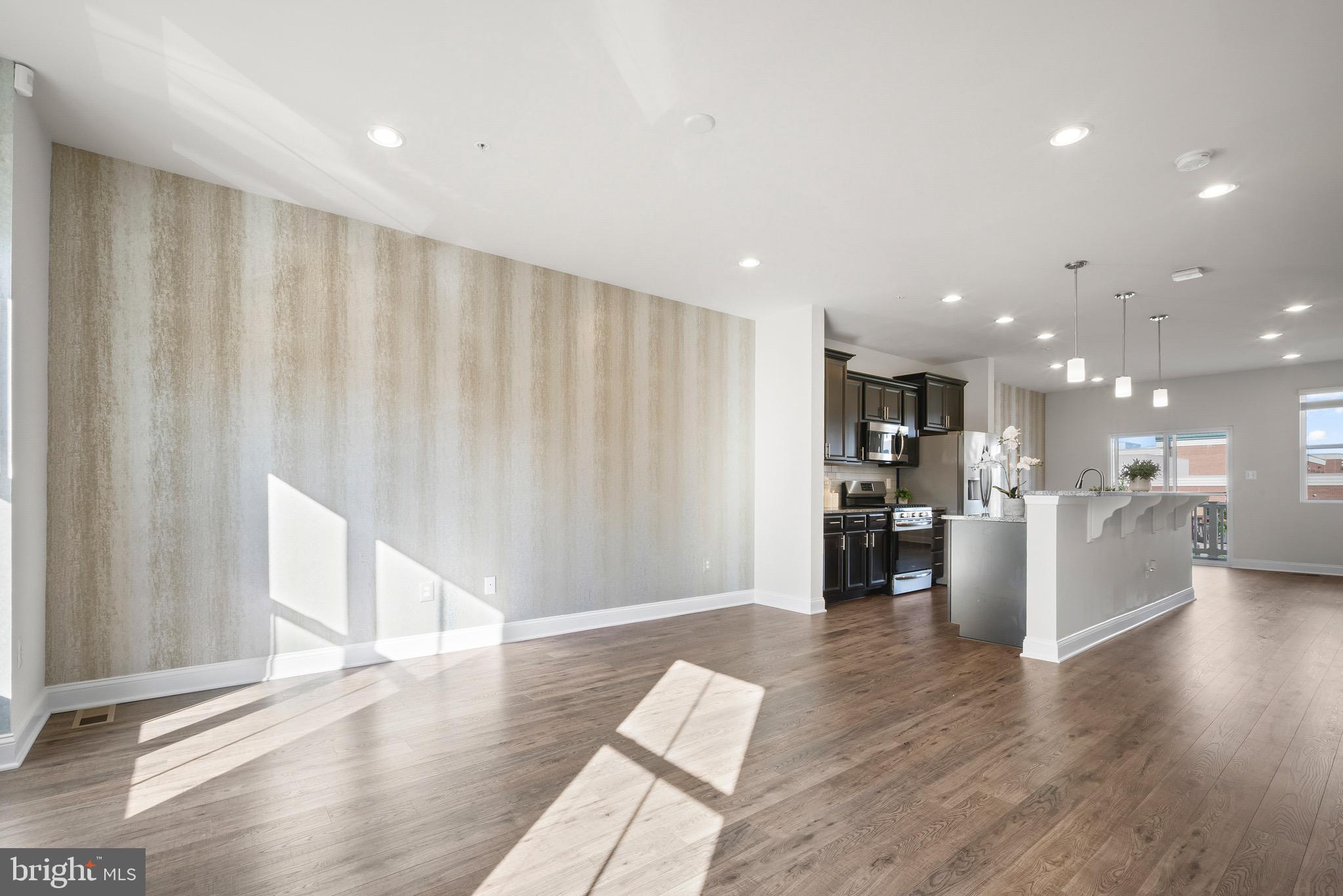 7012 Rackham Way Hanover, MD 21076 - Photo 9 of 46 Family Area | Custom Accent Wall | Recessed Lights