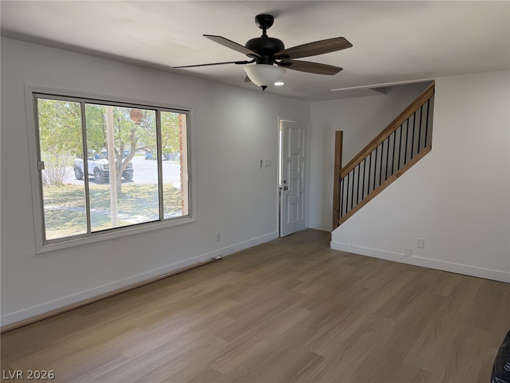 1 Carson Court Ely, NV 89301 - Photo 4 of 20 This bright living area features sleek flooring and a contemporary staircase leading to the upper level.