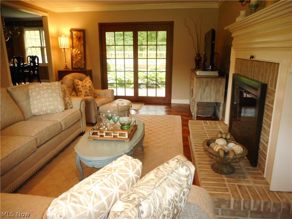 13851 Watt Road Novelty, OH 44072 - Photo 12 of 28 The family room is very special! The fireplace is perfect for curling up to enjoy anytime of the year. With two sets of doors leading to the outside space, you are never far from the action.