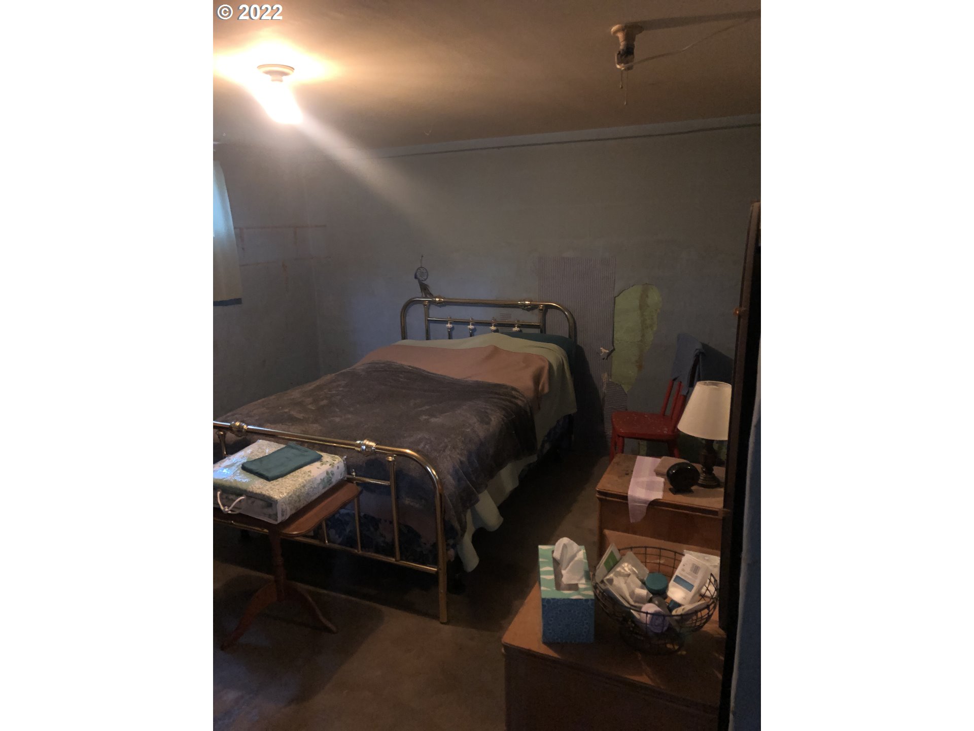 512 Southwest 9th Street Pendleton, OR 97801 - Photo 15 of 19 a bedroom with a bed and a cabinets