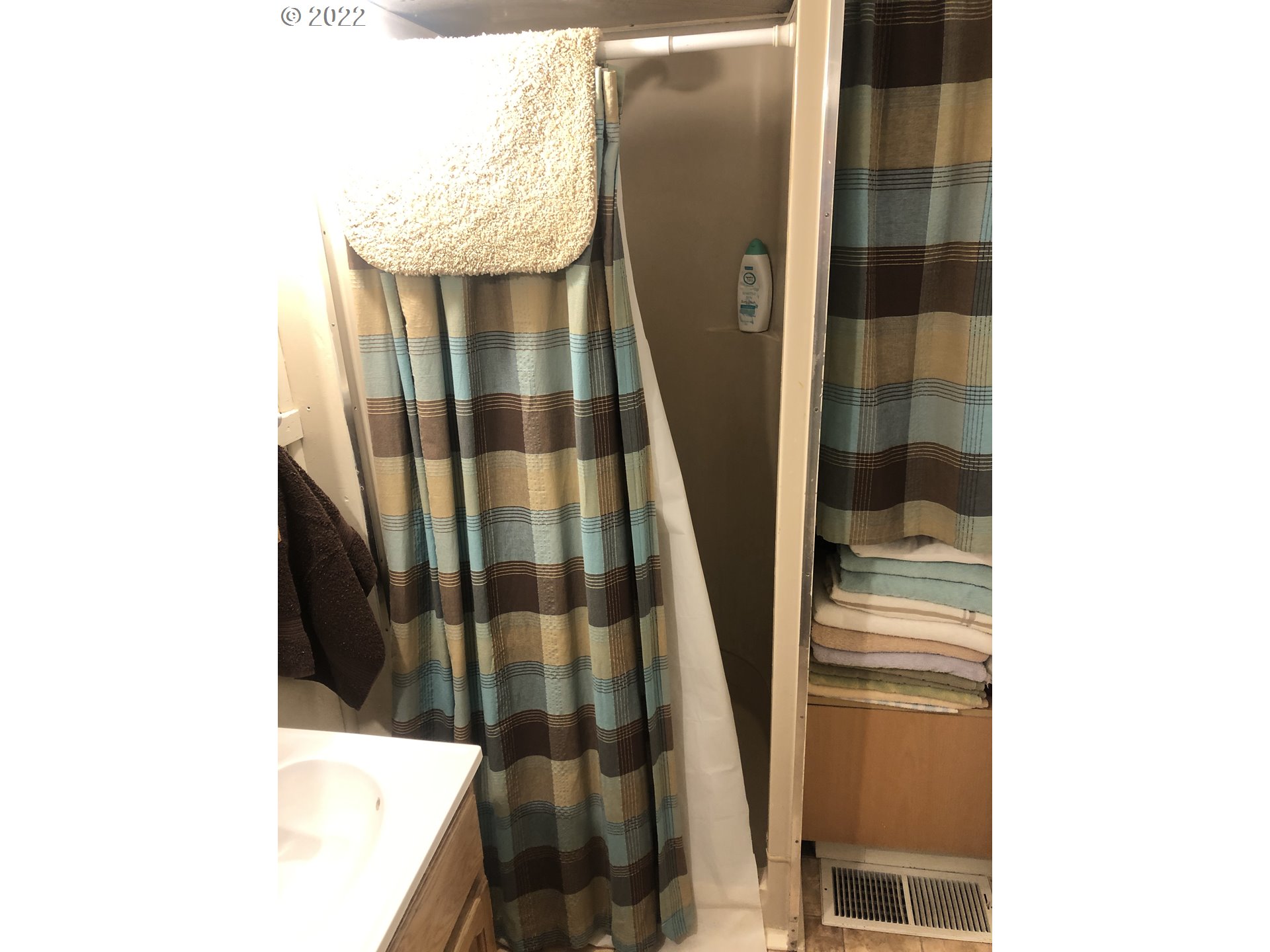 512 Southwest 9th Street Pendleton, OR 97801 - Photo 8 of 19 a bathroom with a sink and a shower