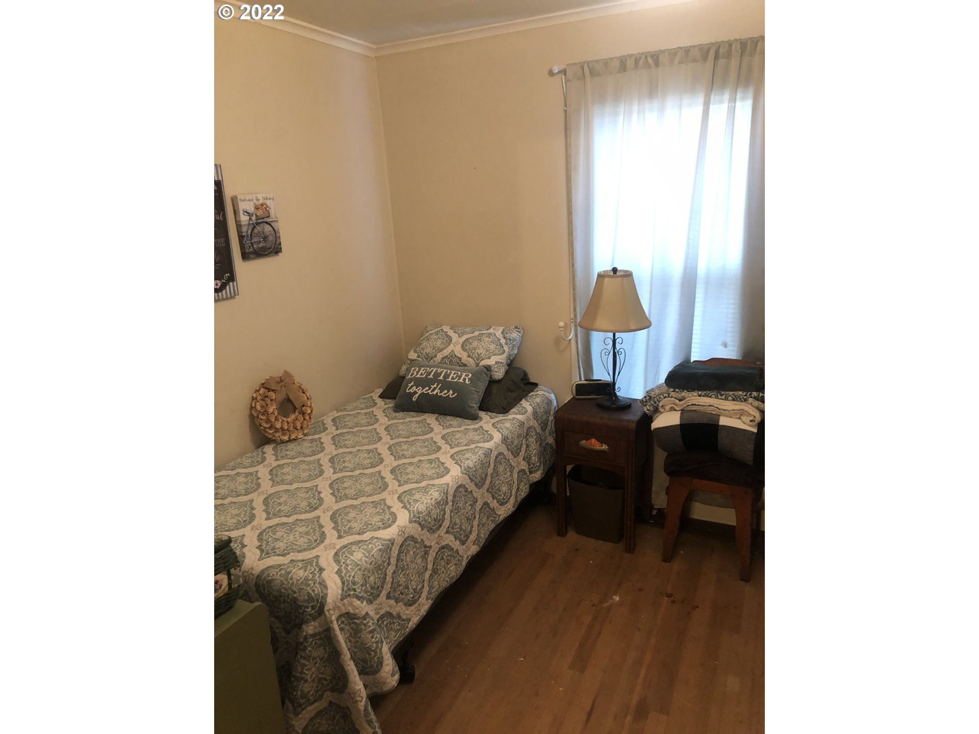 512 Southwest 9th Street Pendleton, OR 97801 - Photo 9 of 19 a bedroom with a bed and a window