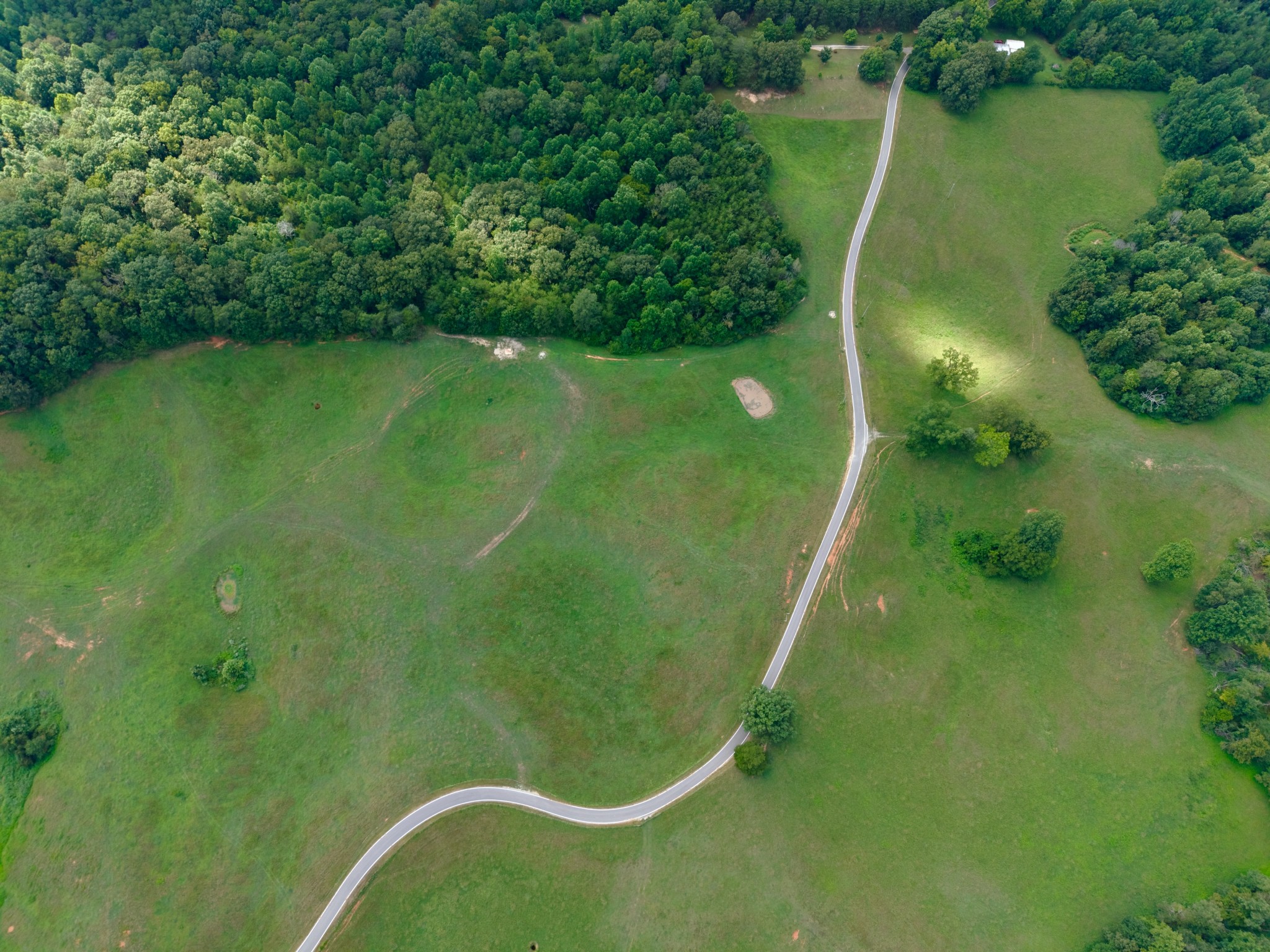 a view of a golf course with a swimming pool