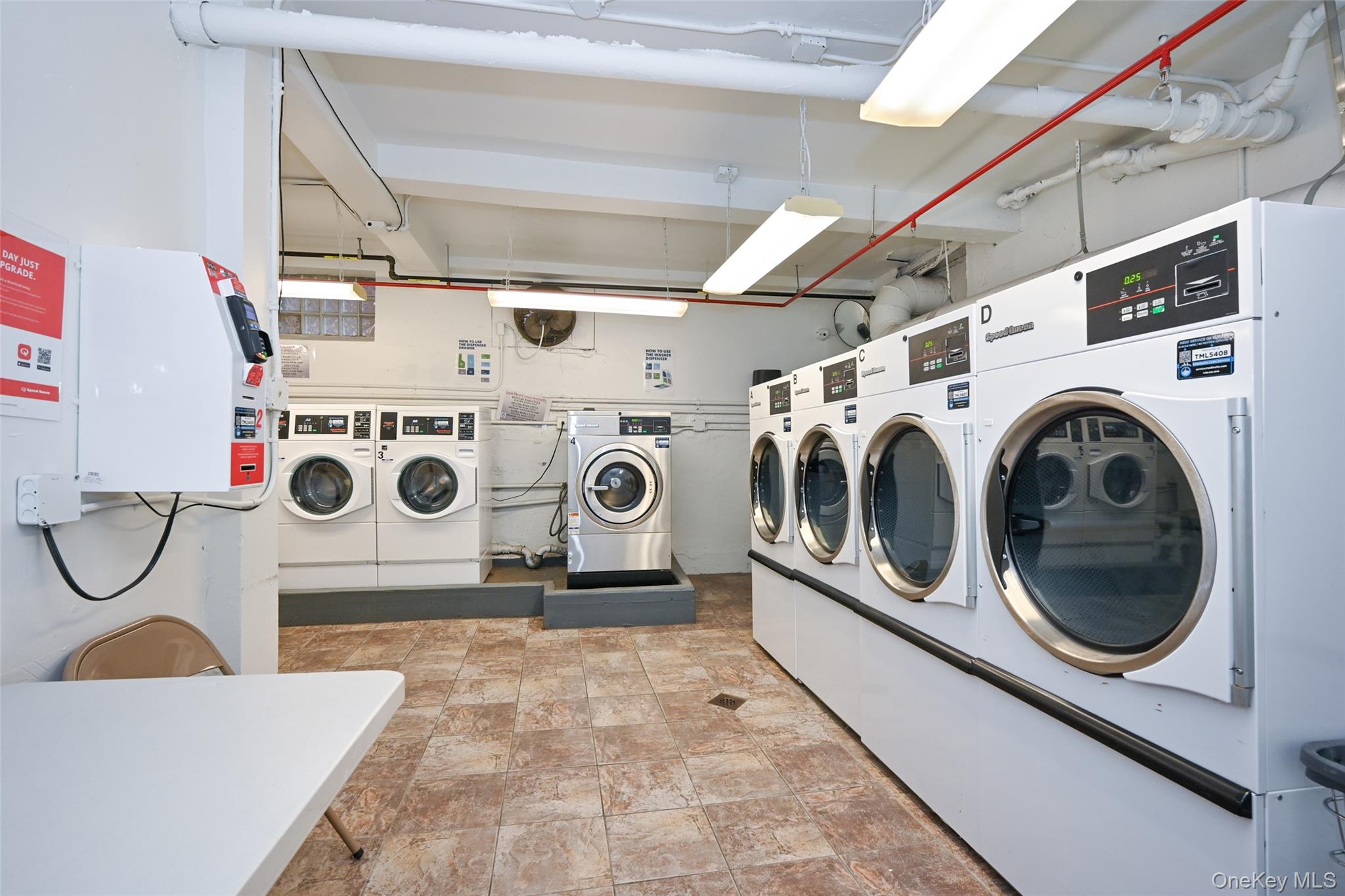 150-30 71st Avenue, Unit 2F Queens, NY 11367 - Photo 14 of 19 Shared laundry featuring washer and dryer