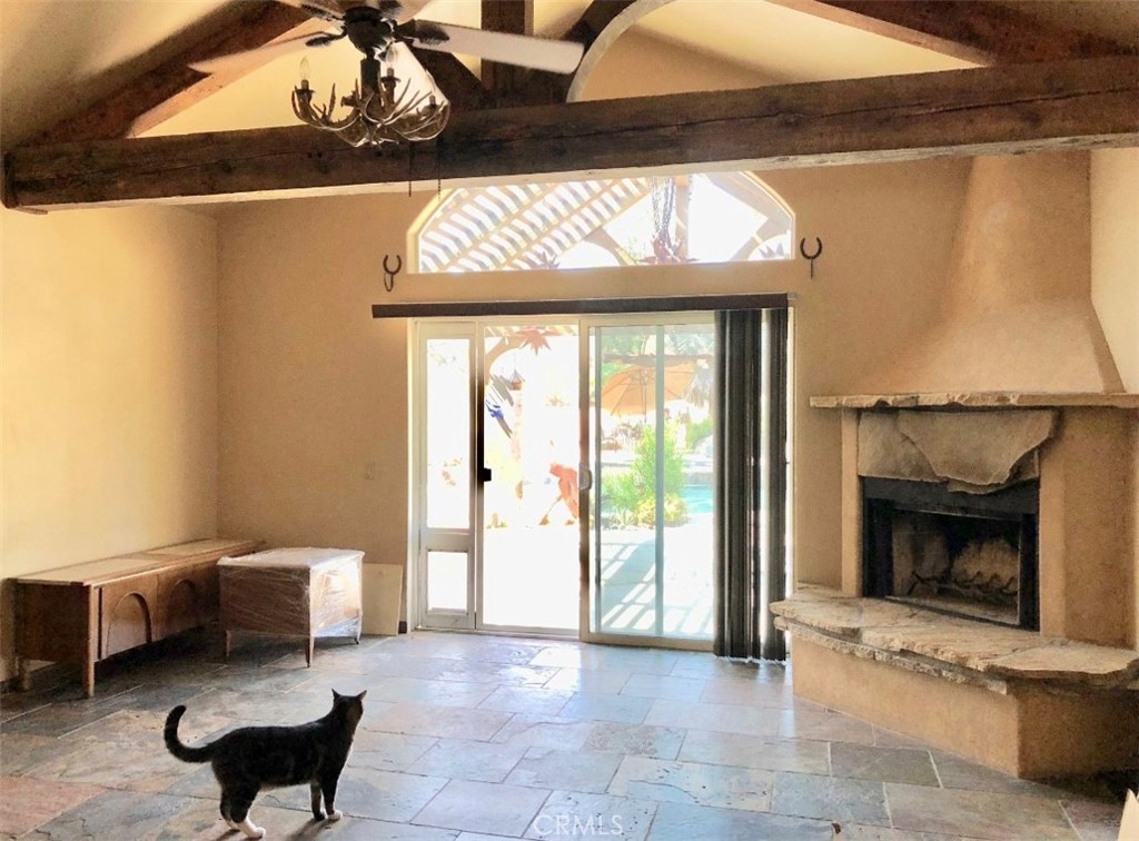 4937 Sweetgrass Lane Bonsall, CA 92003 - Photo 13 of 33 a living room with furniture and a fireplace
