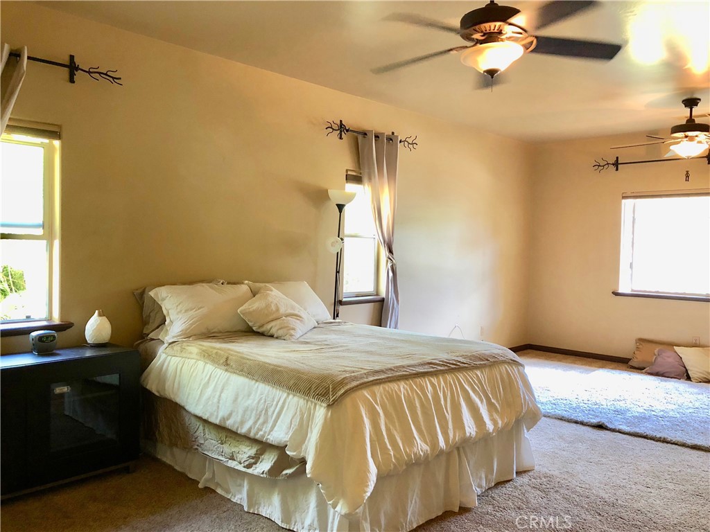 4937 Sweetgrass Lane Bonsall, CA 92003 - Photo 17 of 33 a bedroom with a bed and a window