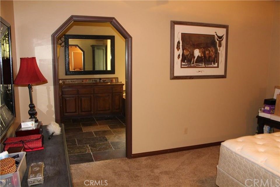 4937 Sweetgrass Lane Bonsall, CA 92003 - Photo 22 of 33 a living room with furniture and a fireplace