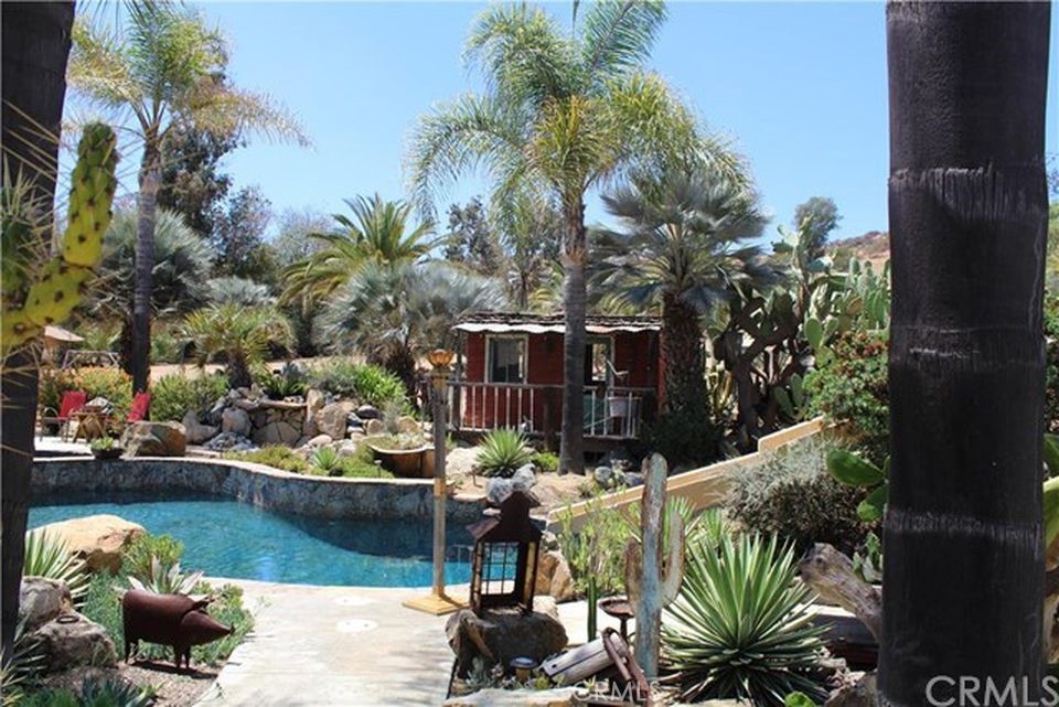 4937 Sweetgrass Lane Bonsall, CA 92003 - Photo 28 of 33 a view of a lake with a patio