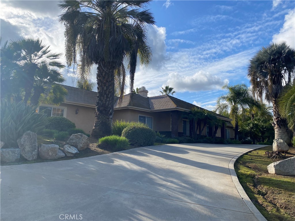 4937 Sweetgrass Lane Bonsall, CA 92003 - Photo 30 of 33 a front view of a house with garden