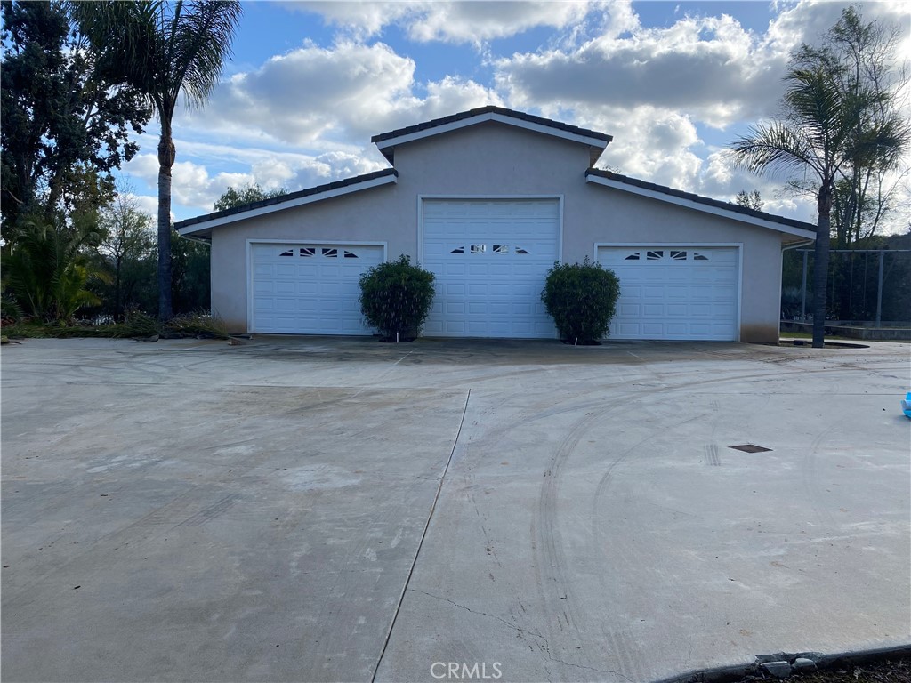4937 Sweetgrass Lane Bonsall, CA 92003 - Photo 32 of 33 a view of a house with a flat yard