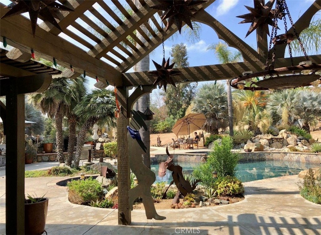 4937 Sweetgrass Lane Bonsall, CA 92003 - Photo 7 of 33 a view of a pathway of a building with a tree