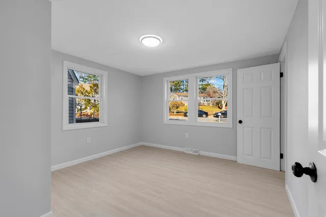 an empty room with windows and window