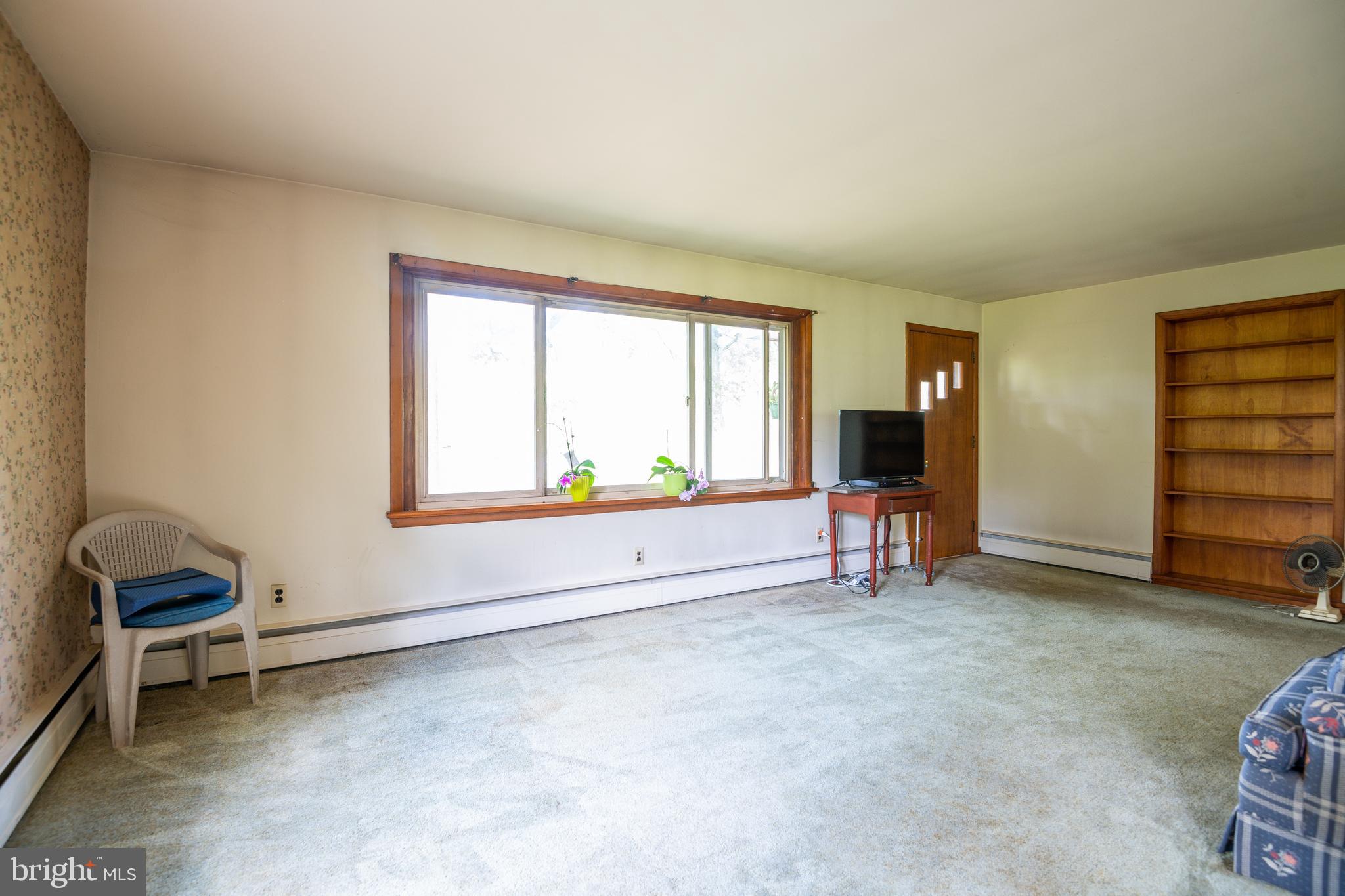 139 Baptist Church Road Spring City, PA 19475 - Photo 12 of 32 an empty room with furniture and a window