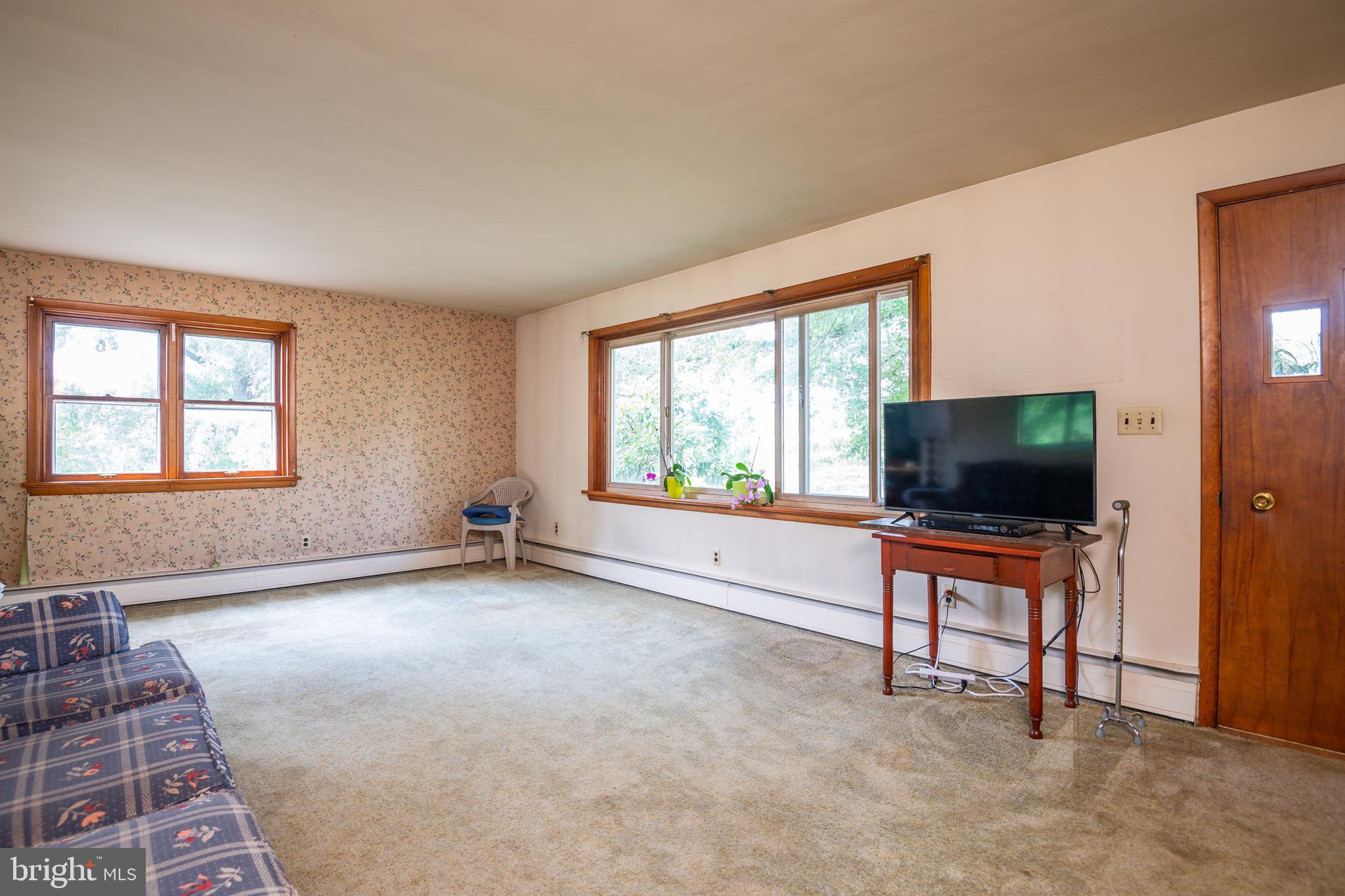 139 Baptist Church Road Spring City, PA 19475 - Photo 13 of 32 an empty room with furniture and a flat screen tv