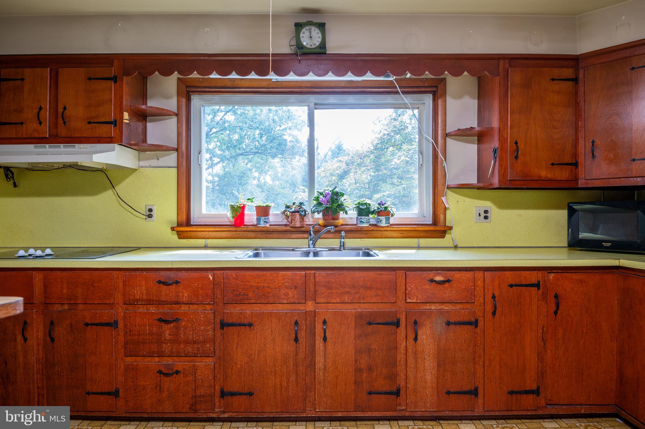 139 Baptist Church Road Spring City, PA 19475 - Photo 19 of 32 a kitchen with wooden cabinets and a large window
