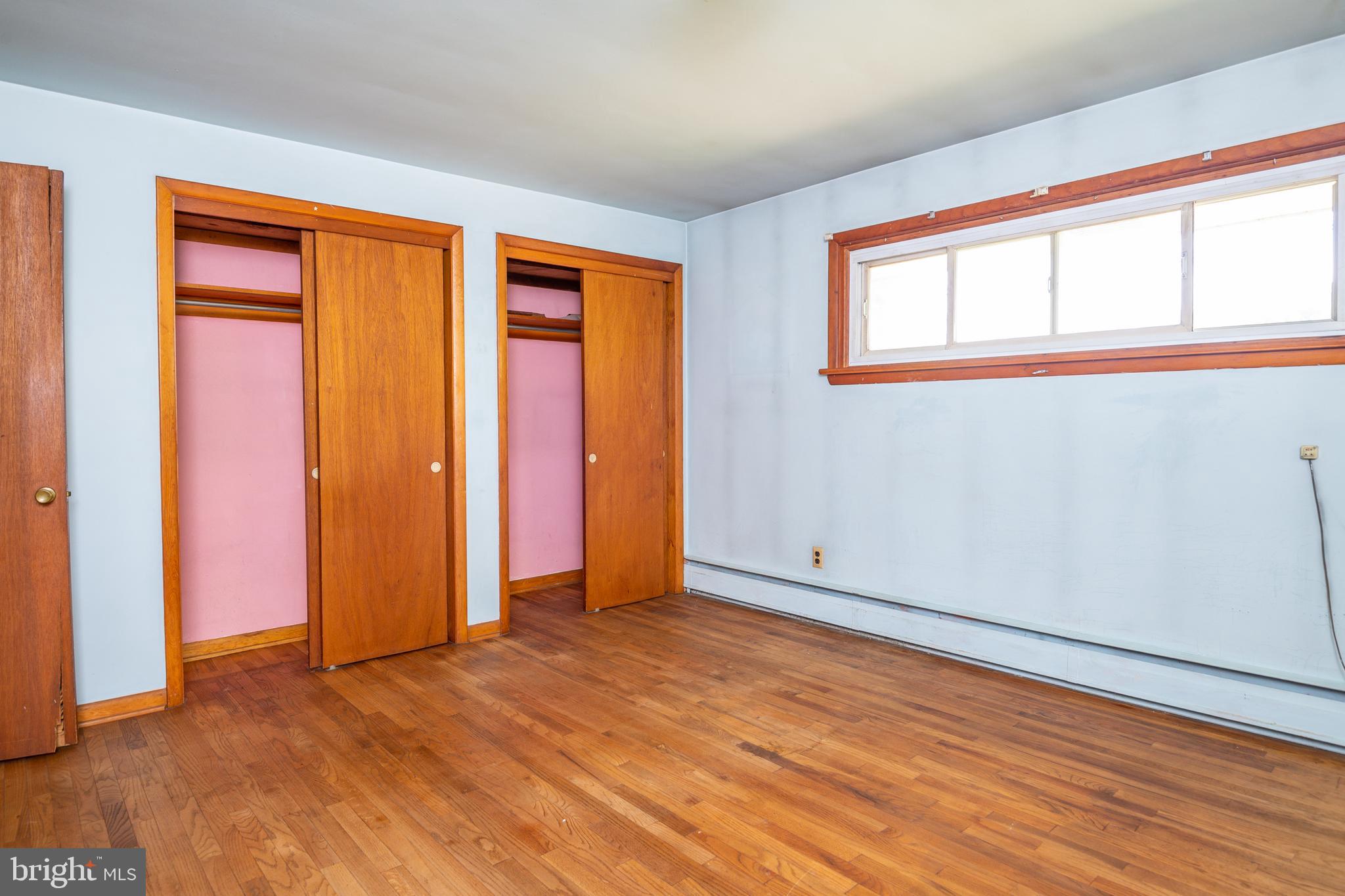 139 Baptist Church Road Spring City, PA 19475 - Photo 23 of 32 a view of an empty room with wooden floor and a window