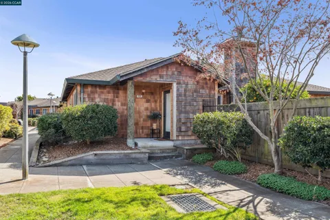 a view of a hallway and a livingroom with furniture