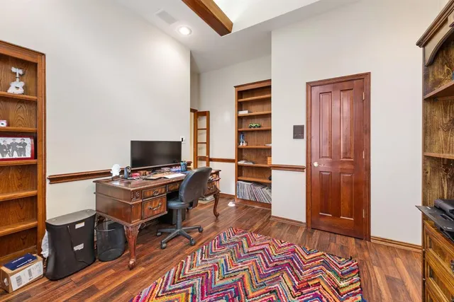 a workspace with furniture and wooden floor