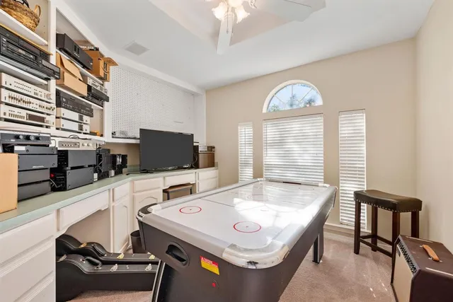 a view of a dining room with furniture and a window