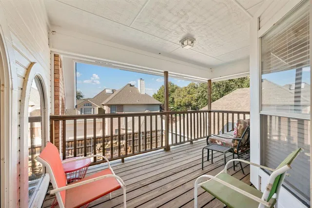 a view of a balcony with wooden floor