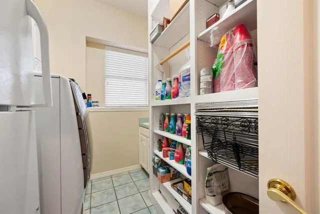 a room with lots of books and a book shelf