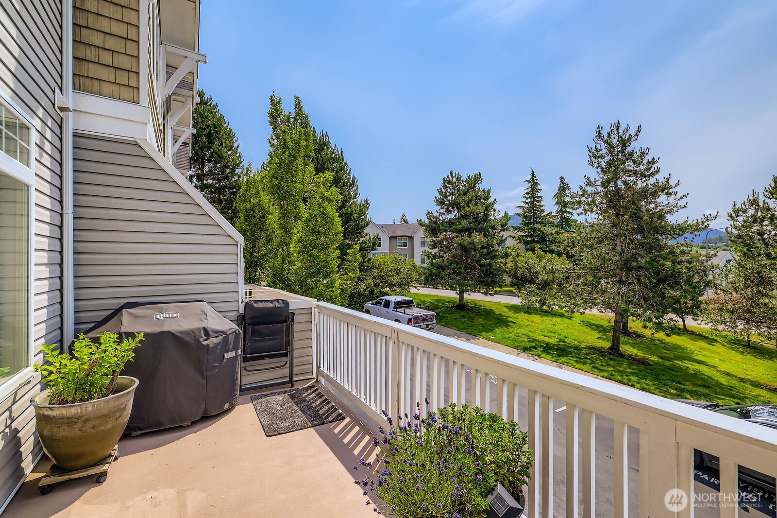 a view of a balcony with wooden floor
