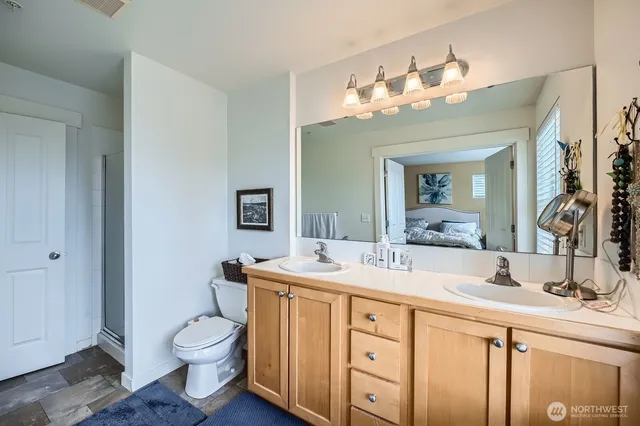 a bathroom with a sink vanity and a mirror