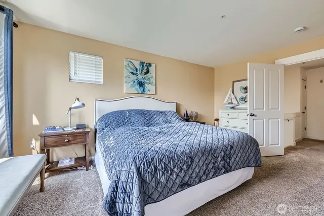 a bedroom with a bed and a table in it