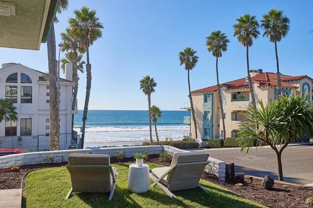 a view of an ocean with outdoor seating