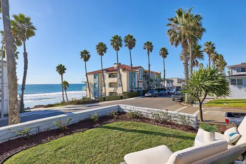 a view of a backyard with palm tree