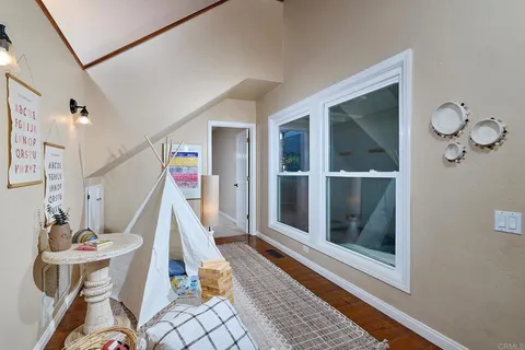 a view of a livingroom with furniture and front door