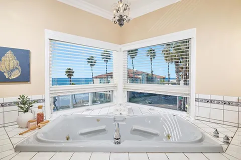 a living room with fireplace and furniture