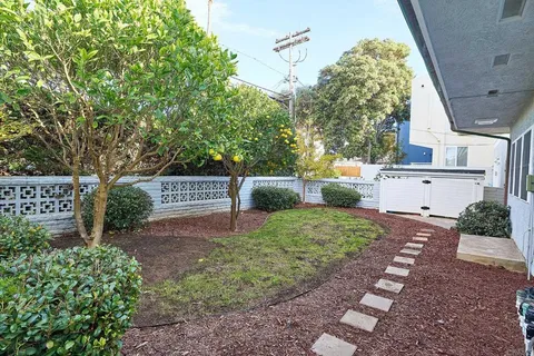 a sign board with yard in front of it