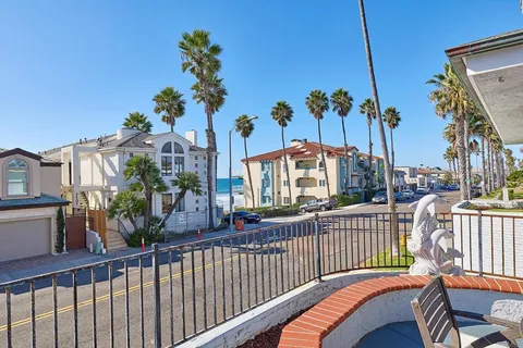 a view of a balcony and yard