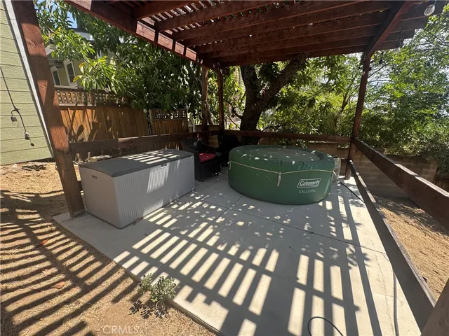 a view of a backyard with sitting area